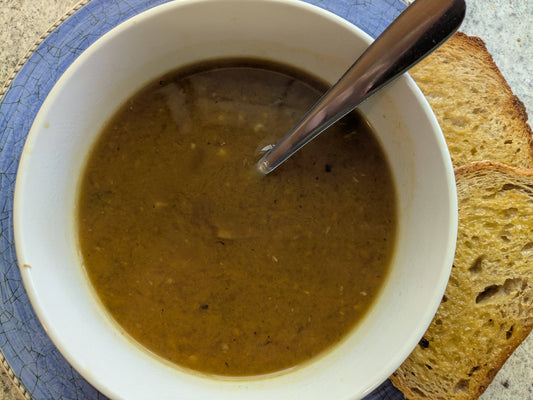 Mushroom soup in bowl with toast